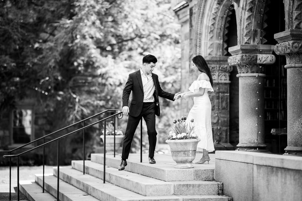 Black and white documentary wedding photo of a couple on stone steps in Vermont, captured by an affordable wedding photographer Vermont couples trust.